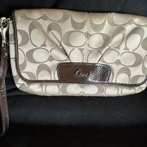 Coach wristlet 9”w X 5”h brown.
